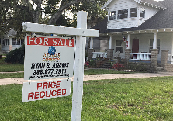 Home For Sale Sign infront of the beautiful new house.