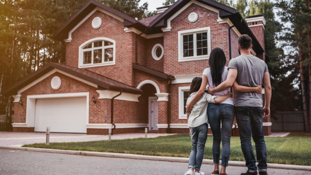 Image showing a family starring their property's front view.